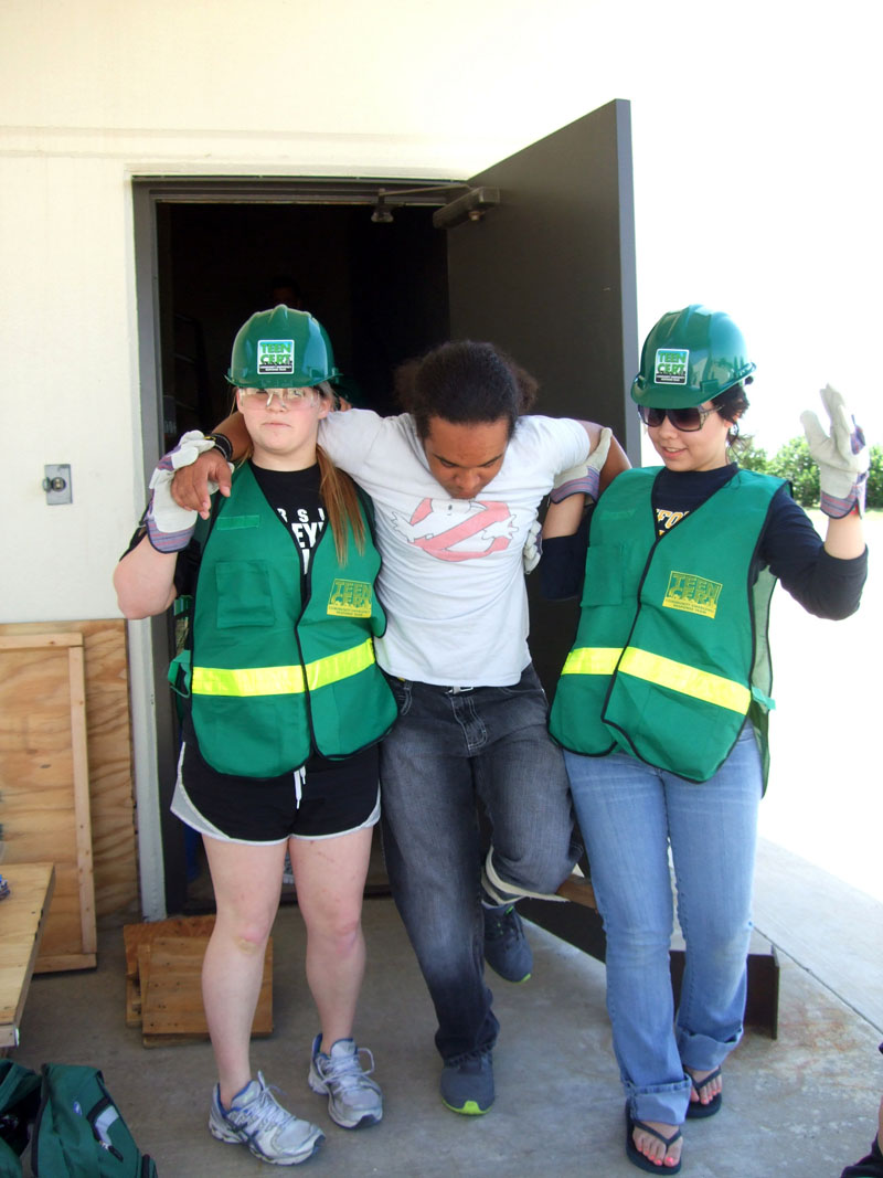 Photo of teens performing training duties